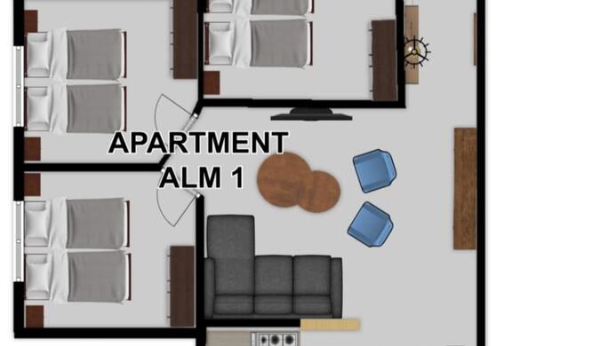 An apartment floor plan with several bedrooms and a balcony. The rooms are clearly defined and include a shower, WC, and a living area.